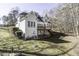Rear exterior of the home, featuring many windows, and a well maintained lawn at 1201 Rivermead Ln, Wake Forest, NC 27587