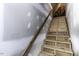 Unfinished wood staircase with exposed studs offers a glimpse into the home's construction at 1201 Rivermead Ln, Wake Forest, NC 27587