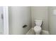 Clean and simple toilet room featuring a standard toilet, fixture, and tiled floors at 1201 Rivermead Ln, Wake Forest, NC 27587