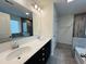 Bathroom with double vanity, shower, and bathtub at 1312 Anthony Wood Ct, Fuquay Varina, NC 27526