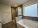 Bathroom with shower, bathtub, and window at 1312 Anthony Wood Ct, Fuquay Varina, NC 27526
