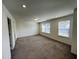 Spacious bedroom with carpet and large windows at 1312 Anthony Wood Ct, Fuquay Varina, NC 27526