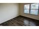 Simple bedroom with hardwood floors and window coverings at 1312 Anthony Wood Ct, Fuquay Varina, NC 27526