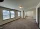 Large bedroom with carpet and access to another room at 1312 Anthony Wood Ct, Fuquay Varina, NC 27526