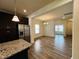 Open dining room with hardwood floors and chandelier at 1312 Anthony Wood Ct, Fuquay Varina, NC 27526