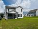 Two-story white house with screened porch and backyard at 1312 Anthony Wood Ct, Fuquay Varina, NC 27526