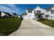 Two-story white house with a two-car garage and a driveway at 1312 Anthony Wood Ct, Fuquay Varina, NC 27526