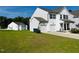 Two-story white house with a two-car garage and a side yard at 1312 Anthony Wood Ct, Fuquay Varina, NC 27526
