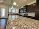Modern kitchen with stainless steel appliances and granite countertops at 1312 Anthony Wood Ct, Fuquay Varina, NC 27526