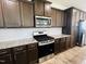 Well-equipped kitchen, featuring gas range and granite countertops at 1312 Anthony Wood Ct, Fuquay Varina, NC 27526