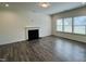 Bright living room with hardwood floors and fireplace at 1312 Anthony Wood Ct, Fuquay Varina, NC 27526