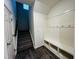 Stairwell with dark wood flooring and coat closet at 1312 Anthony Wood Ct, Fuquay Varina, NC 27526