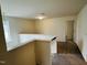 Upper level hallway with carpeting and window at 1312 Anthony Wood Ct, Fuquay Varina, NC 27526