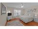 Bright bedroom with a king-size bed, hardwood floors, and large windows at 1315 Legacy Greene Ave, Wake Forest, NC 27587