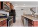 Kitchen with stainless steel appliances and granite countertops at 163 Wethergate Dr, Clayton, NC 27527