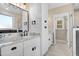 Bathroom with granite countertop, white cabinets, and black fixtures at 1647 Old Dam Rd, Kenly, NC 27542