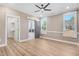 Spacious bedroom with hardwood floors and barn door to en-suite bathroom at 1647 Old Dam Rd, Kenly, NC 27542