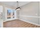 Bright dining area with hardwood floors and french doors leading to the backyard at 1647 Old Dam Rd, Kenly, NC 27542