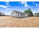 Rear view of house featuring screened porch at 1647 Old Dam Rd, Kenly, NC 27542