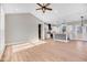 Open concept kitchen with island, white cabinets, and modern appliances at 1647 Old Dam Rd, Kenly, NC 27542