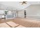 Open concept kitchen with white cabinets, granite countertops, and a large island at 1647 Old Dam Rd, Kenly, NC 27542