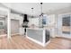 Modern kitchen with white cabinets, granite countertops, and stainless steel appliances at 1647 Old Dam Rd, Kenly, NC 27542