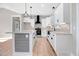Modern kitchen with white cabinets, granite countertops and stainless steel appliances at 1647 Old Dam Rd, Kenly, NC 27542