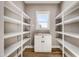 Walk-in pantry with ample shelving for storage at 1647 Old Dam Rd, Kenly, NC 27542