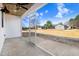 Screened porch with concrete flooring, ceiling fan, and view of backyard at 1647 Old Dam Rd, Kenly, NC 27542