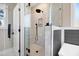 Large walk-in shower with glass enclosure, pebble floor, and built-in seat at 1647 Old Dam Rd, Kenly, NC 27542