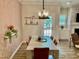 Dining area with geometric wallpaper and modern dining table at 166 Gulley Glen Dr, Garner, NC 27529