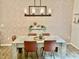 Modern dining room with geometric wallpaper and a concrete table at 166 Gulley Glen Dr, Garner, NC 27529