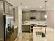 Modern kitchen with stainless steel appliances and an island at 166 Gulley Glen Dr, Garner, NC 27529
