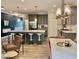 Modern kitchen with gray cabinets, white countertops, and stainless steel appliances at 166 Gulley Glen Dr, Garner, NC 27529