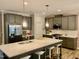 Modern kitchen with stainless steel appliances and an island at 166 Gulley Glen Dr, Garner, NC 27529