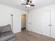 Bright bedroom with ceiling fan, carpet, and double doors to closet at 215 Dutchess Dr, Cary, NC 27513