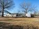 White house with a front porch, screened porch, and detached shed at 2281 Old Route 22, Kenly, NC 27542