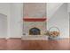 Brick fireplace with wood storage in a spacious living room at 232 Lakeview Dr, Sanford, NC 27332