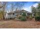 House back view with deck and large windows at 232 Lakeview Dr, Sanford, NC 27332