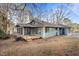 Ranch style home with deck, attached garage, and mature trees at 232 Lakeview Dr, Sanford, NC 27332
