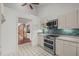 Modern kitchen with stainless steel appliances and blue tile backsplash at 232 Lakeview Dr, Sanford, NC 27332