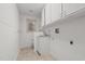 Bright laundry room with cabinets and a sink at 232 Lakeview Dr, Sanford, NC 27332