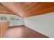 Bright loft bedroom with wood floors and window at 232 Lakeview Dr, Sanford, NC 27332