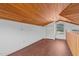 Loft bedroom with wood floors and window at 232 Lakeview Dr, Sanford, NC 27332