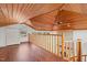 Spacious loft area with wood floors and a ceiling fan at 232 Lakeview Dr, Sanford, NC 27332