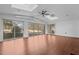 Bright sunroom with hardwood floors, golf course views, and skylights at 232 Lakeview Dr, Sanford, NC 27332