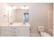 Bright bathroom featuring a double sink vanity, white cabinets, and a tiled floor at 237 Hopewell Branch Ct, Smithfield, NC 27577
