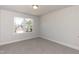 Bright bedroom featuring a large window and carpet at 237 Hopewell Branch Ct, Smithfield, NC 27577