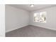 Simple bedroom with carpet and large window at 237 Hopewell Branch Ct, Smithfield, NC 27577