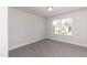 Neutral bedroom with a window providing natural light and a view at 237 Hopewell Branch Ct, Smithfield, NC 27577